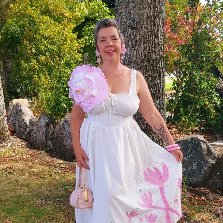 customer of nip stories wearing dress with nipple covers