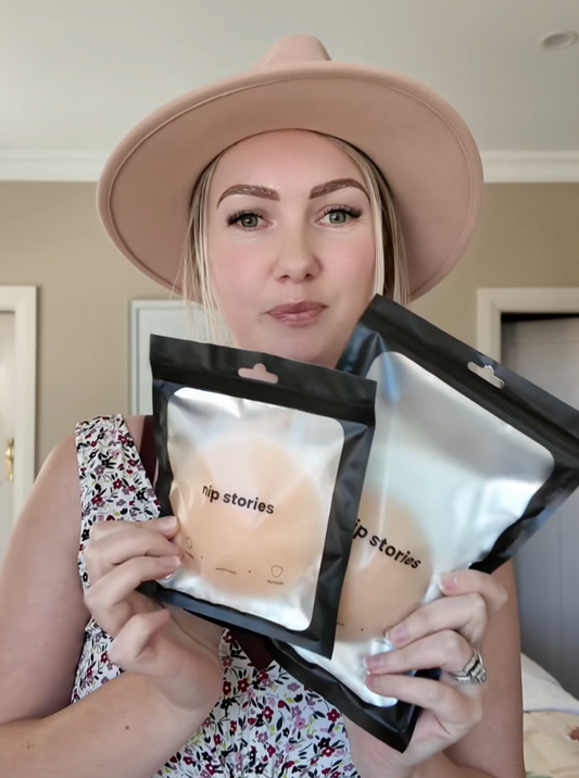 woman holding nip stories nipple covers
