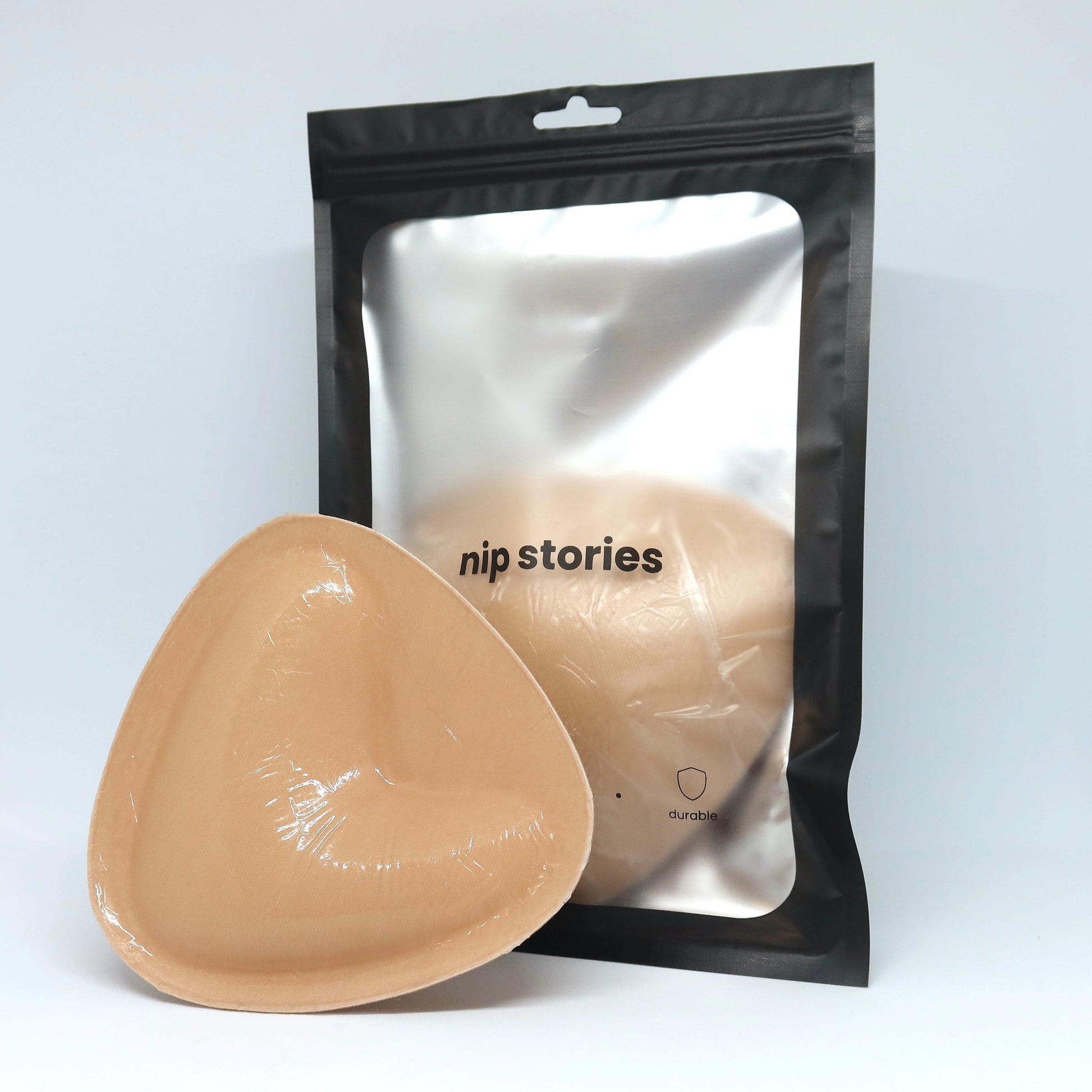 front view of large double sided adhesive bra inserts by nip stories in packaging 2