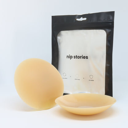 front view of nip stories 10 cm dark adhesive nipple covers in nz