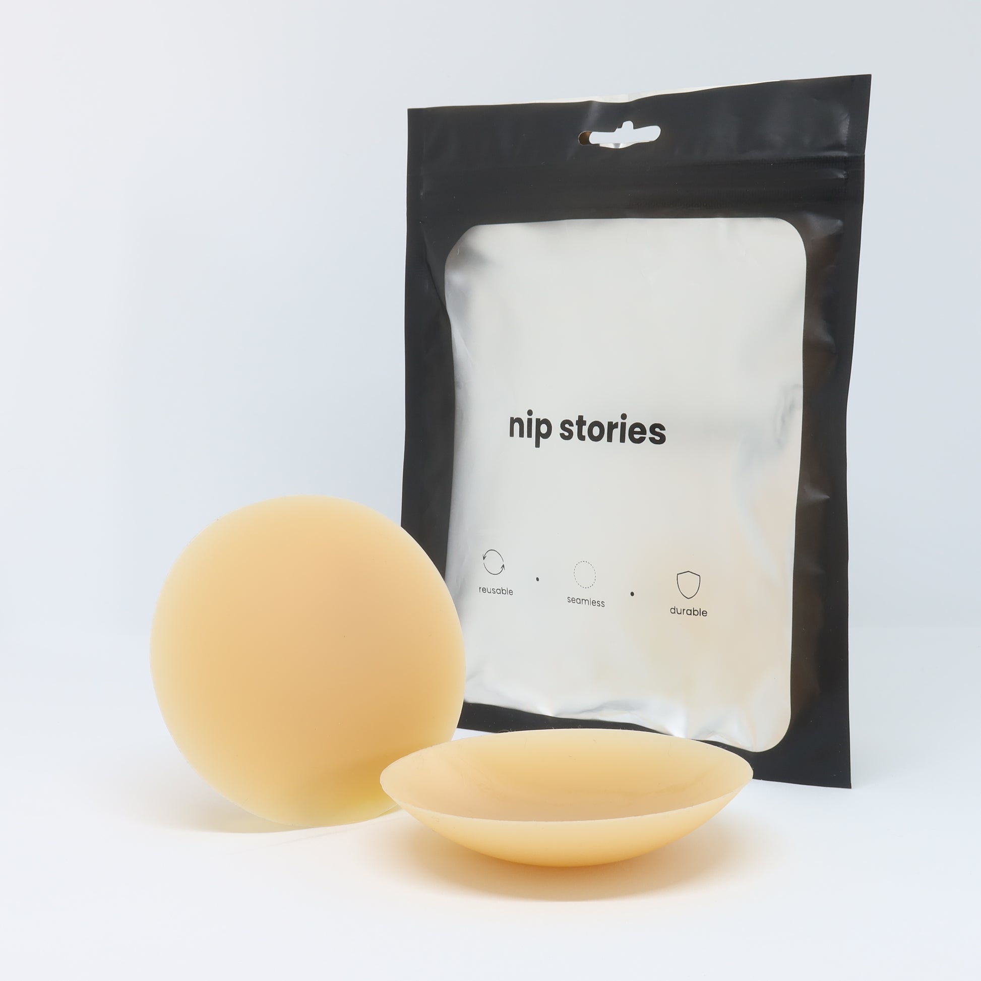 front view of nip stories 8 cm dark adhesive nipple covers in nz