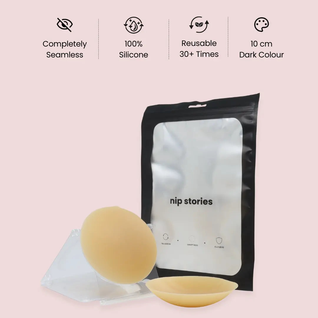 nip stories 10 cm Dark colour non-adhesive nipple covers with packaging on a pink background