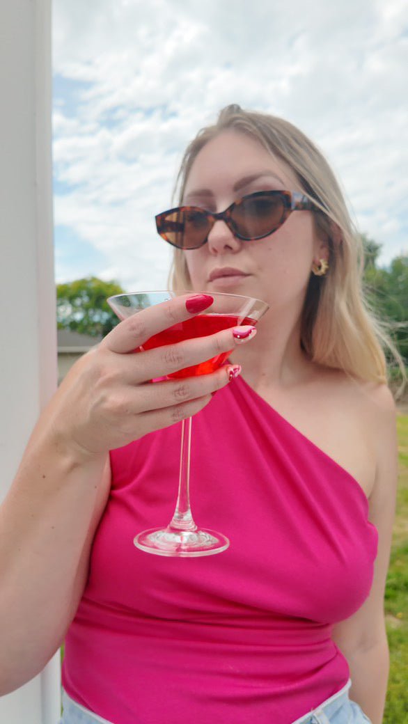 woman wearing off shoulder top using nip stories nipple covers